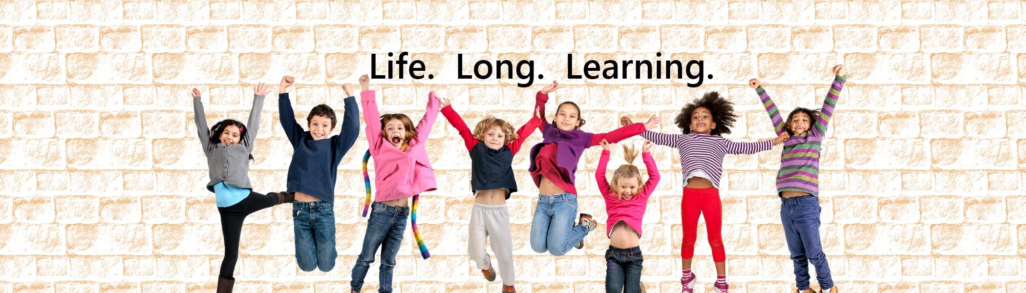Children in a row jumping up with the words life long learning above them