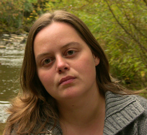 Close up of face, outdoors beside river