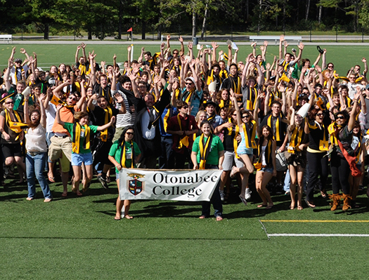 Group of Otonabee College students with college banner