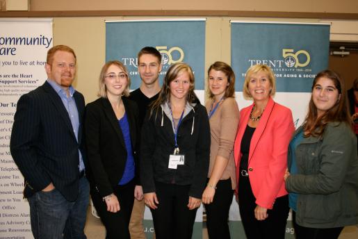Photo: Dr. Mark Skinner and MPP Laurie Scott (Haliburton-Kawartha Lakes-Brock) with Trent University nursing and health geography students, pictured  in Buckhorn last month at the announcement of the Ontario Trillium Foundation grant in support of Age-Friendly Peterborough.