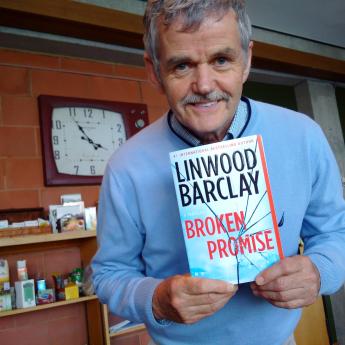 President Leo Groarke shows of his copy of the latest Linwood Barclay book. 