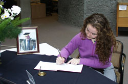 Signing the book