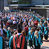 Convocating students standing on the podium in their gowns: June 5, 2014 - Morning