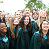 Convocating nursing students standing outside posing for a group photo in front of the Athletic's Centre in their gowns: June 5, 2015 - Morning