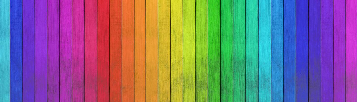 Planks of wood lined vertically painted to resemble the colour spectrum
