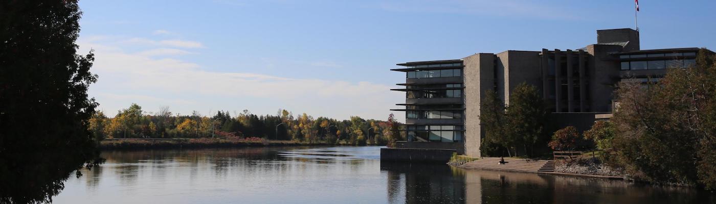 A view of bata library on the right with the Otonabee river on the left