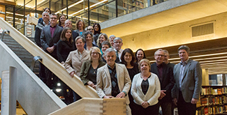 The Strategic Enrolment Management team standing in a group on the staircase of the Bata library on the first floor