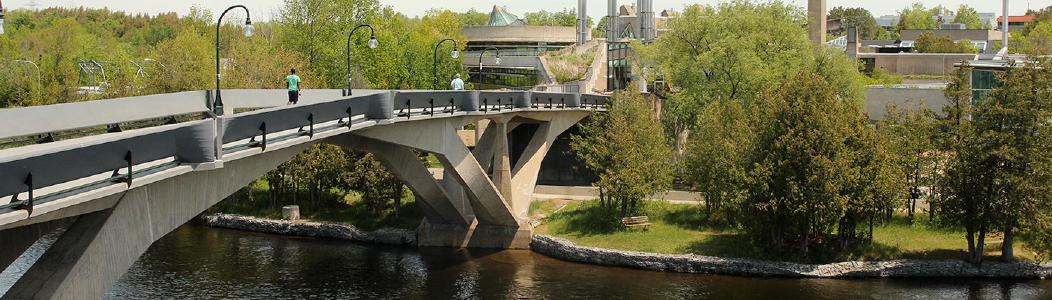 Person walking across Faryon Bridge