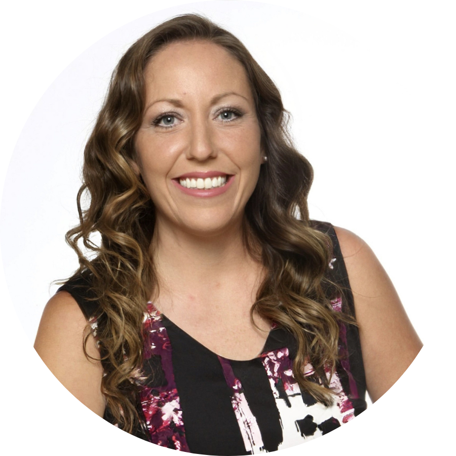 Sarah, a transfer student, smiling at the camera in front of a green background. 