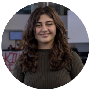 Katia, a transfer student, standing on the upper level of Trent’s Student Centre 