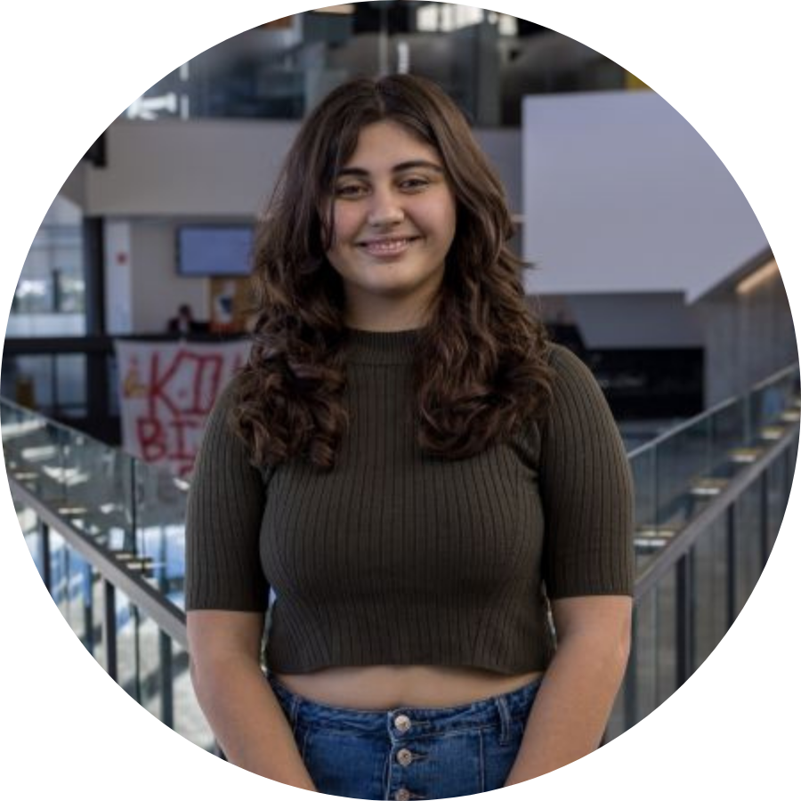Katia, a transfer student, standing on the upper level of Trent’s Student Centre 
