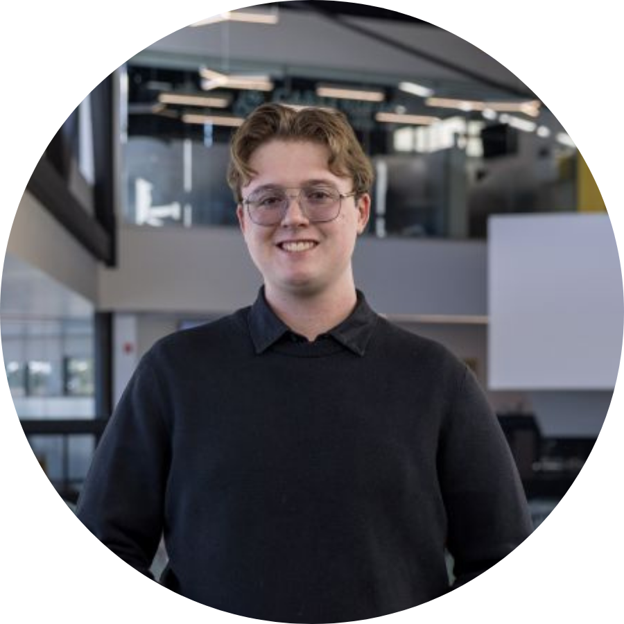 Martin, a transfer student, standing on the upper level of Trent’s Student Centre 