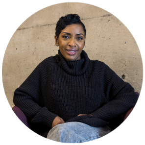 Raine, a transfer student, seated in a purple chair in Trent’s Bata Library