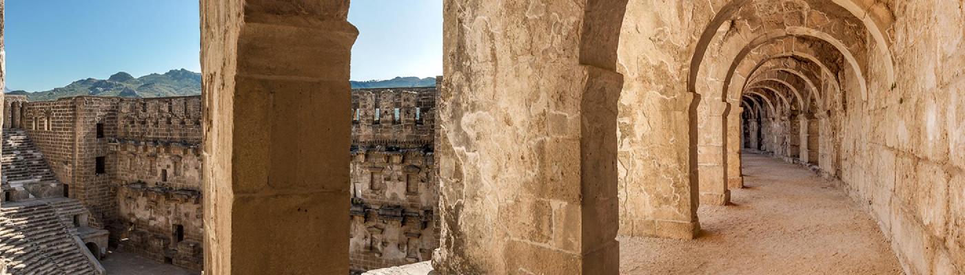 archways of the coliseum leading down a tunnel