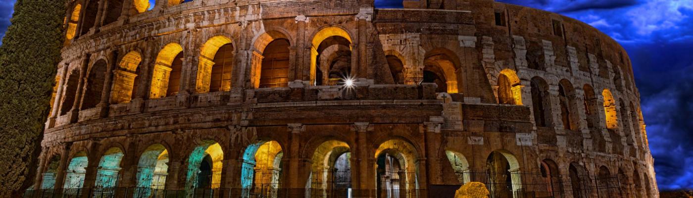 coliseum at night lit from the inside