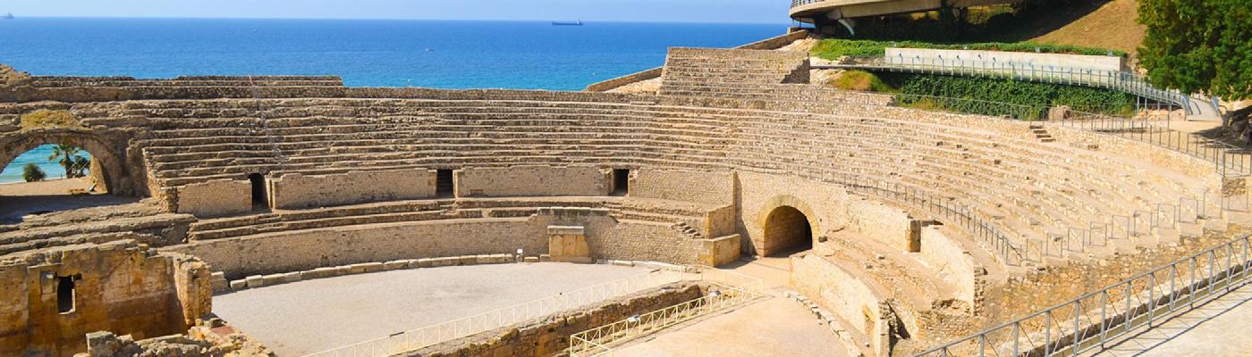 coliseum at noon beside the sea