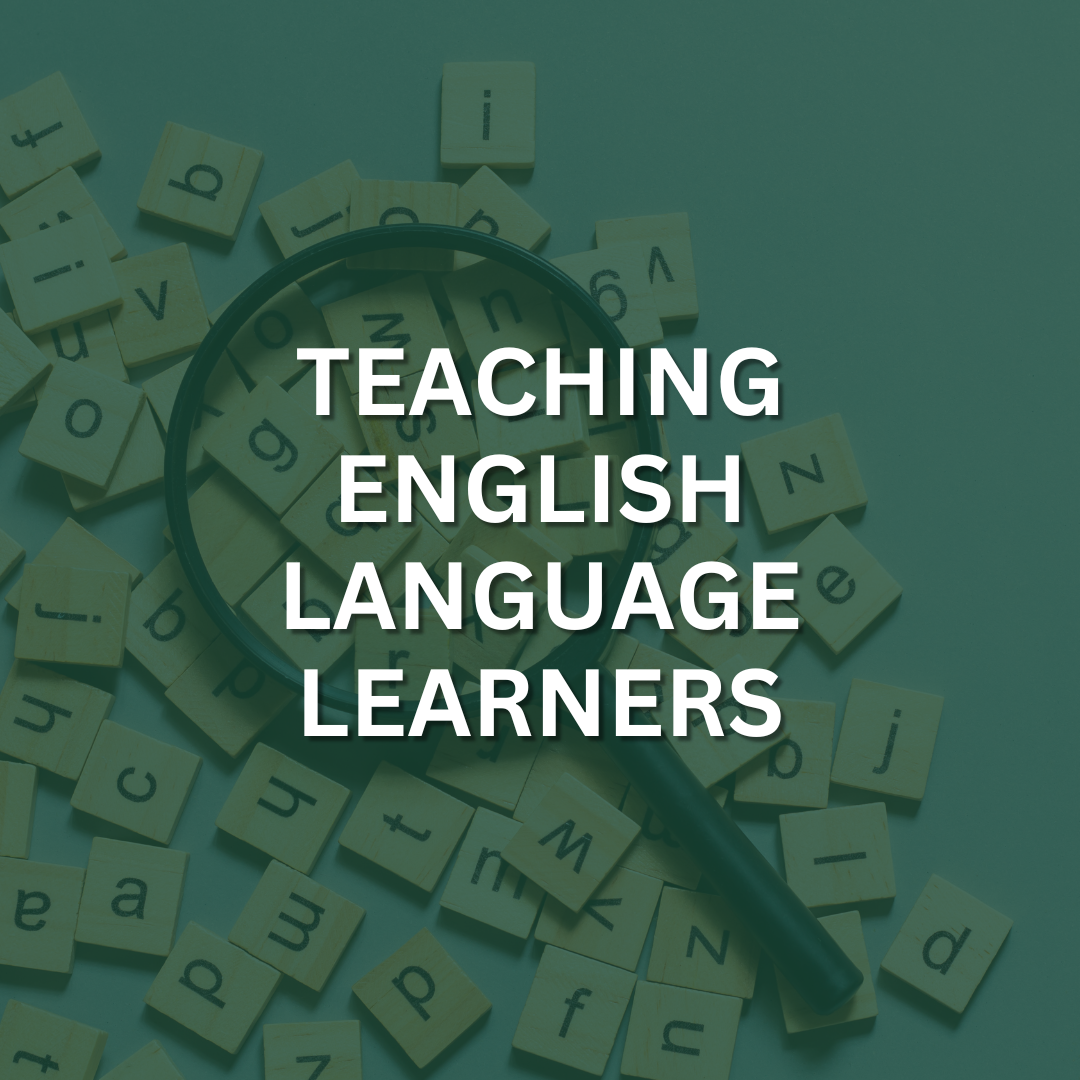 A magnifying glass laying on a pile of alphabet tiles