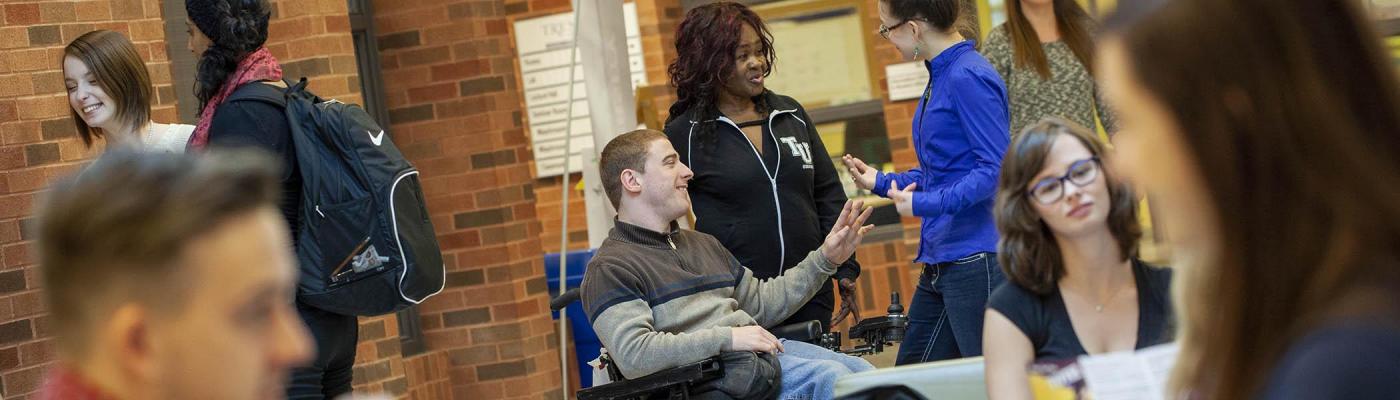 Students gather in front of the Trent University Durham GTA library. 