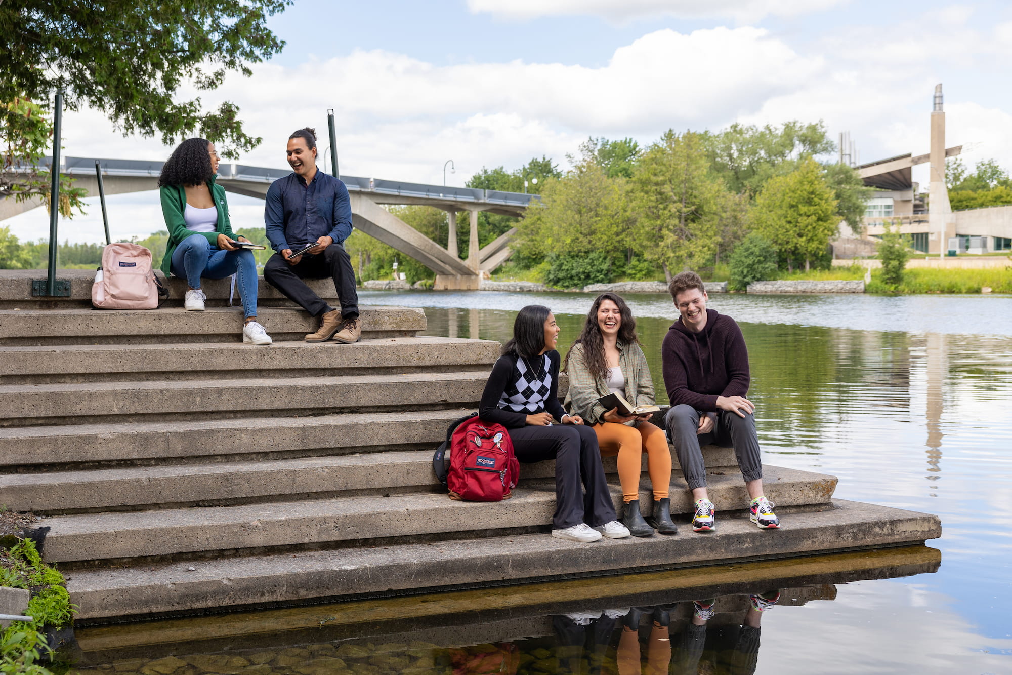 students sitting on steps