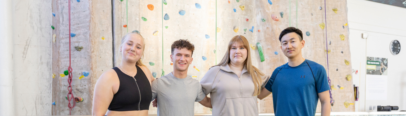 Students in Front of Rock Wall