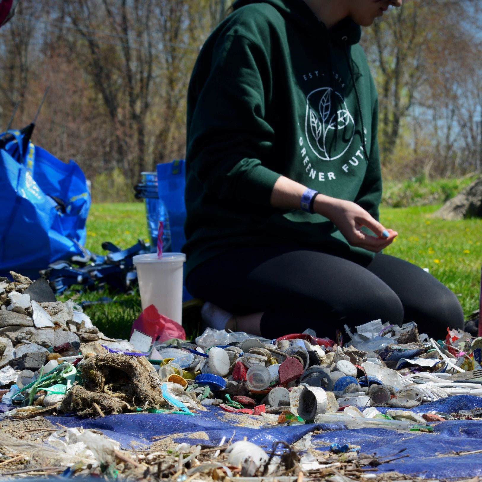 student sorting beach trash