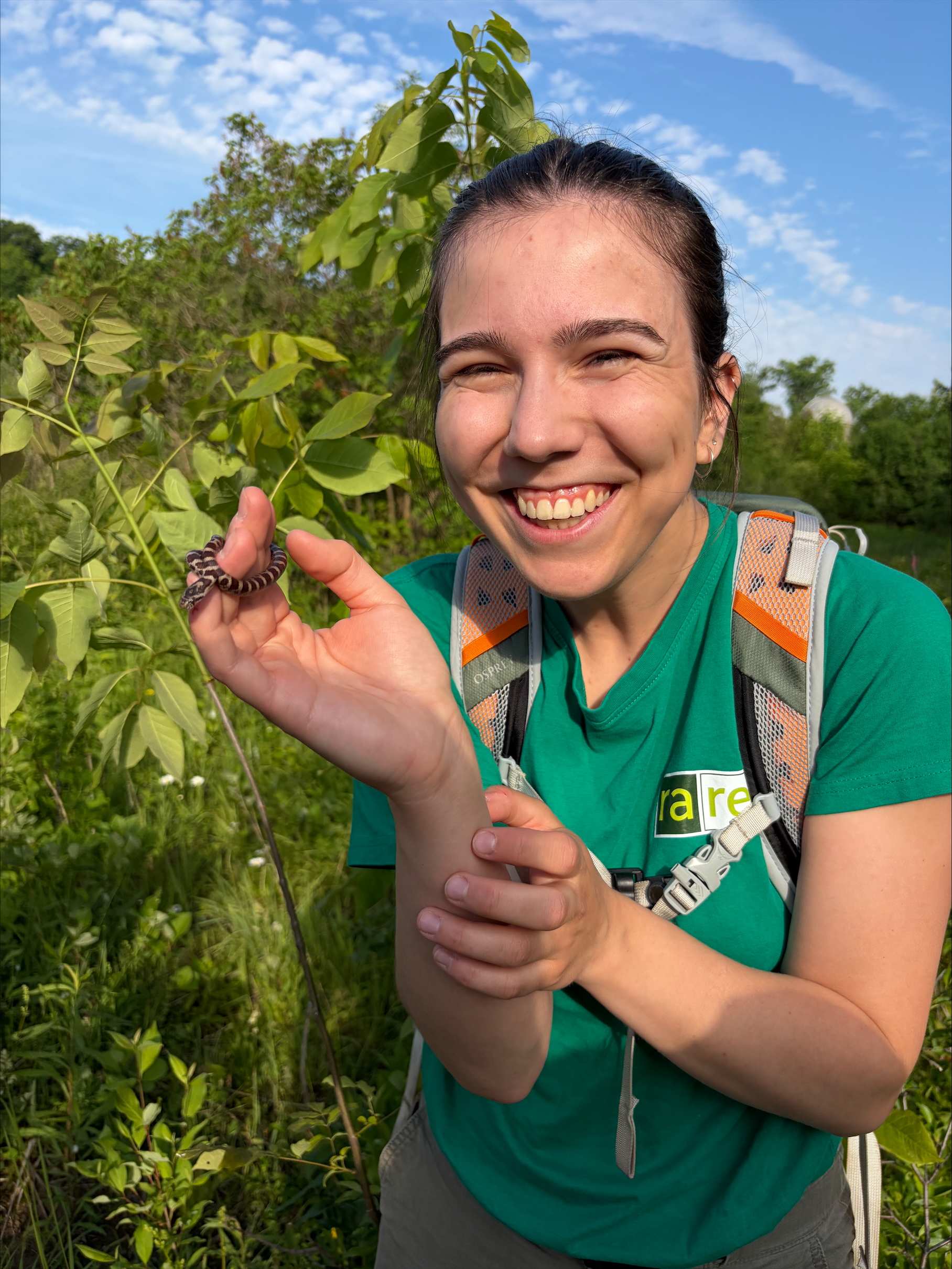 Student holding snake