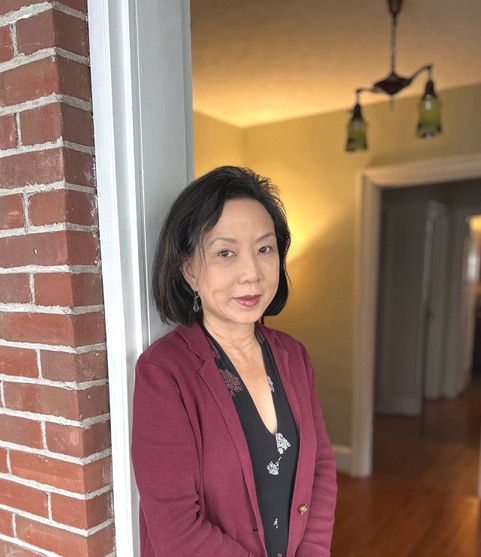 Janet Yee, a women standing in a doorway