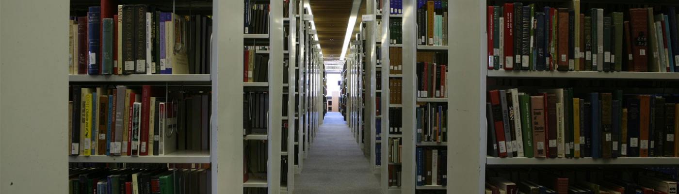 Image of rows of books in the library.