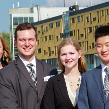 Business students smiling in front of Gowski