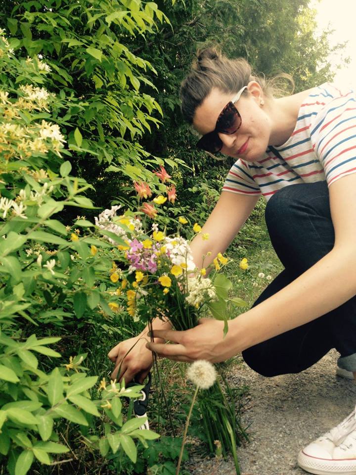 Colleen Stratford-Kurus picking flowers in the garden post-grad