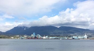 Vancouver horizon with mountains in background, water in foreground
