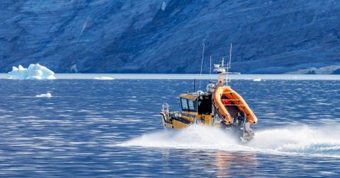 Northeast Greenland 23 Aug 2025: - Sirius Patrol boat speeds through the waters of Northeast Greenland National Park. Part of the Dog Sled patrol team, enforcing Danish sovereignty in the region.