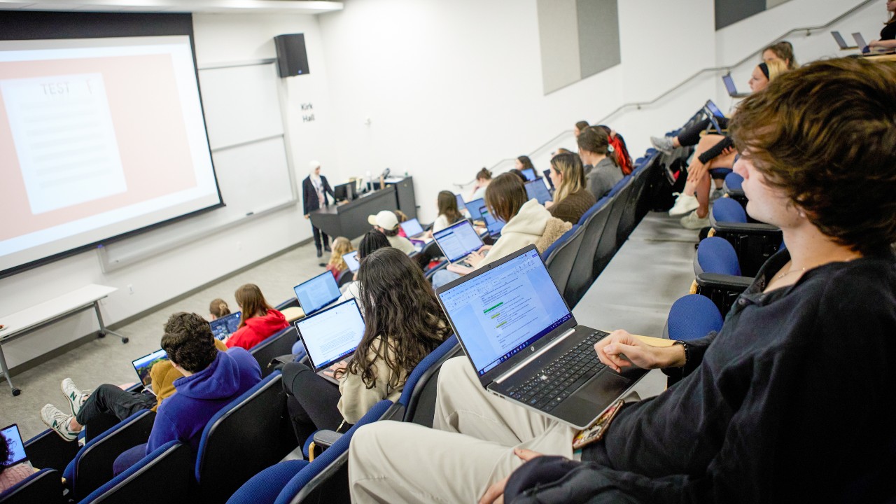 Students in a large lecture hall