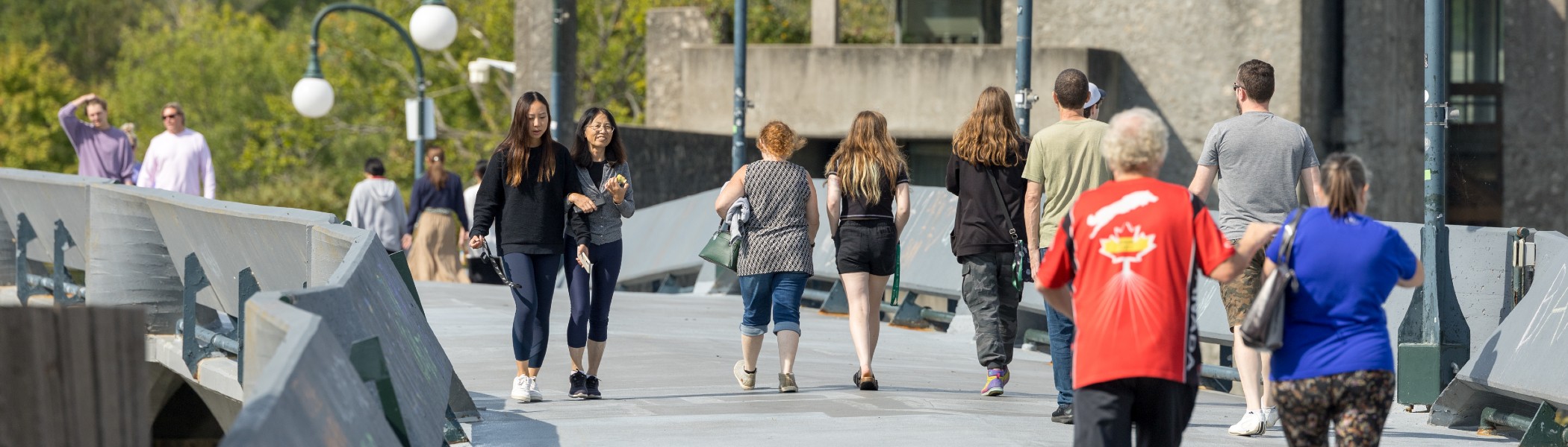 People walking on the Faryon Bridge