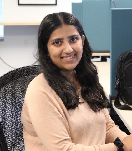 A photo of co-op student Tahsin at an office desk.