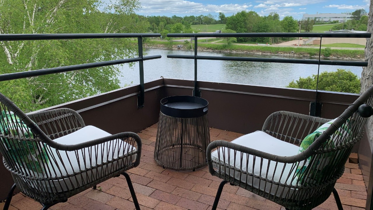 Patio chairs overlooking the Otonabee River