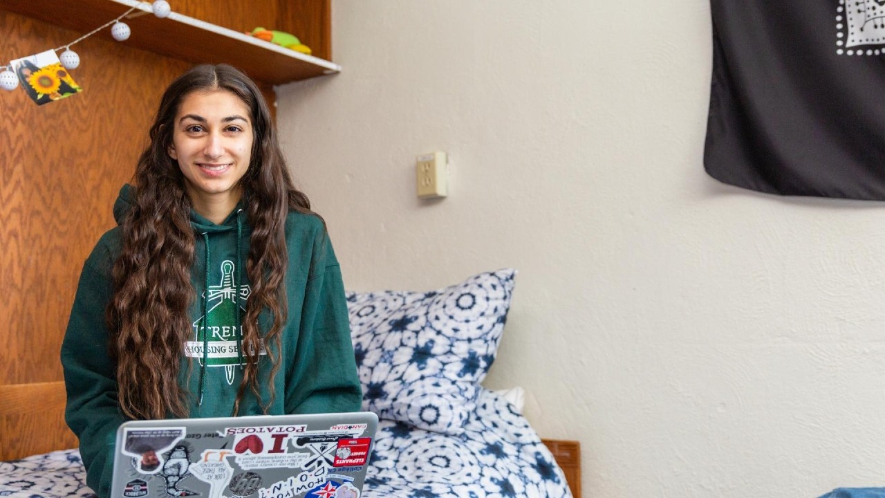 A student in a residence room
