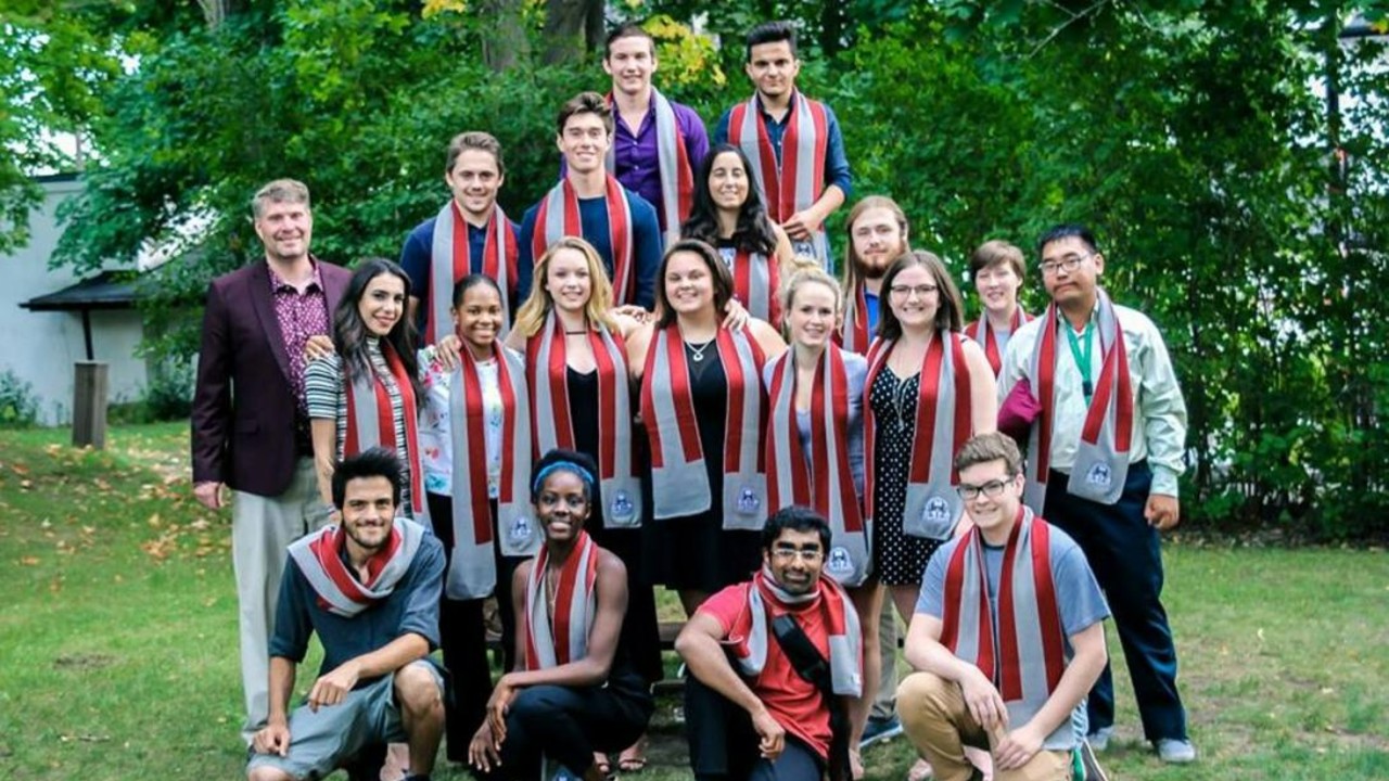 Students wearing Traill College scarves