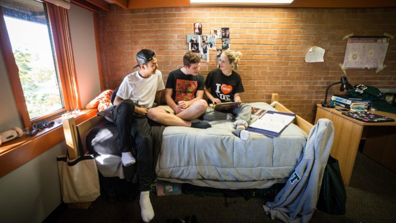 Students sitting in a Traill College residence room