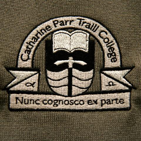 The Traill College crest