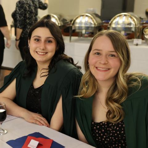 Two students at a Champlain dinner