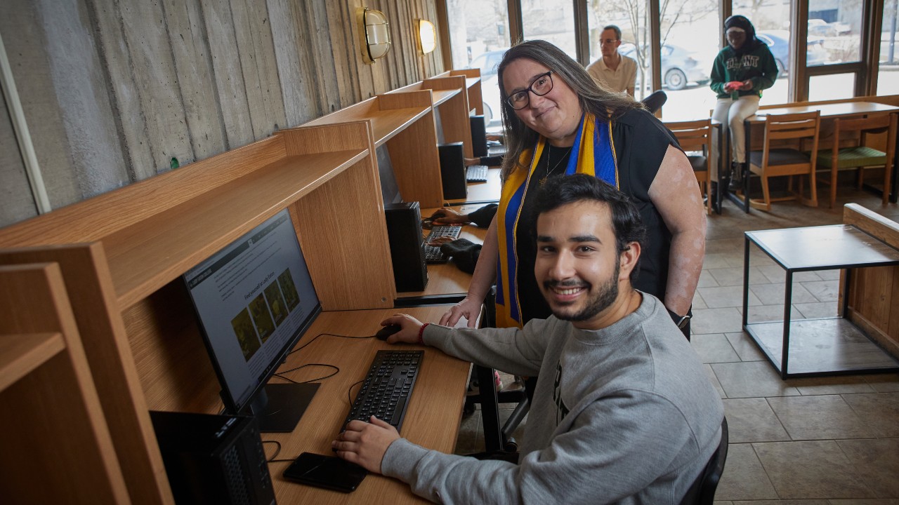 Christine Freeman Roth with a student