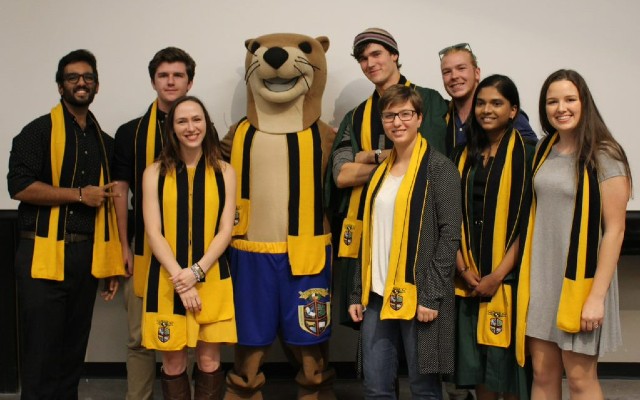 A group of students wearing Otonabee College scarves