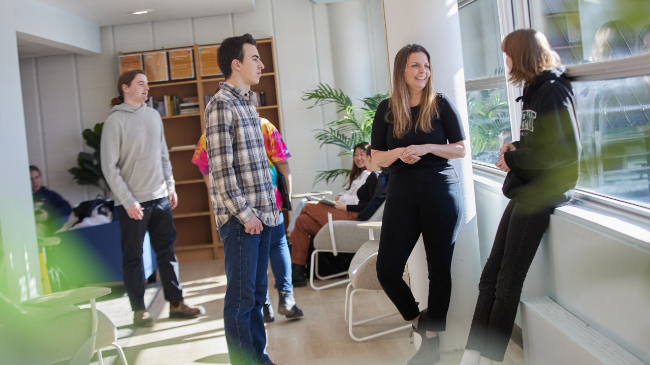 Dr. Stephanie Muehlethaler talking with students