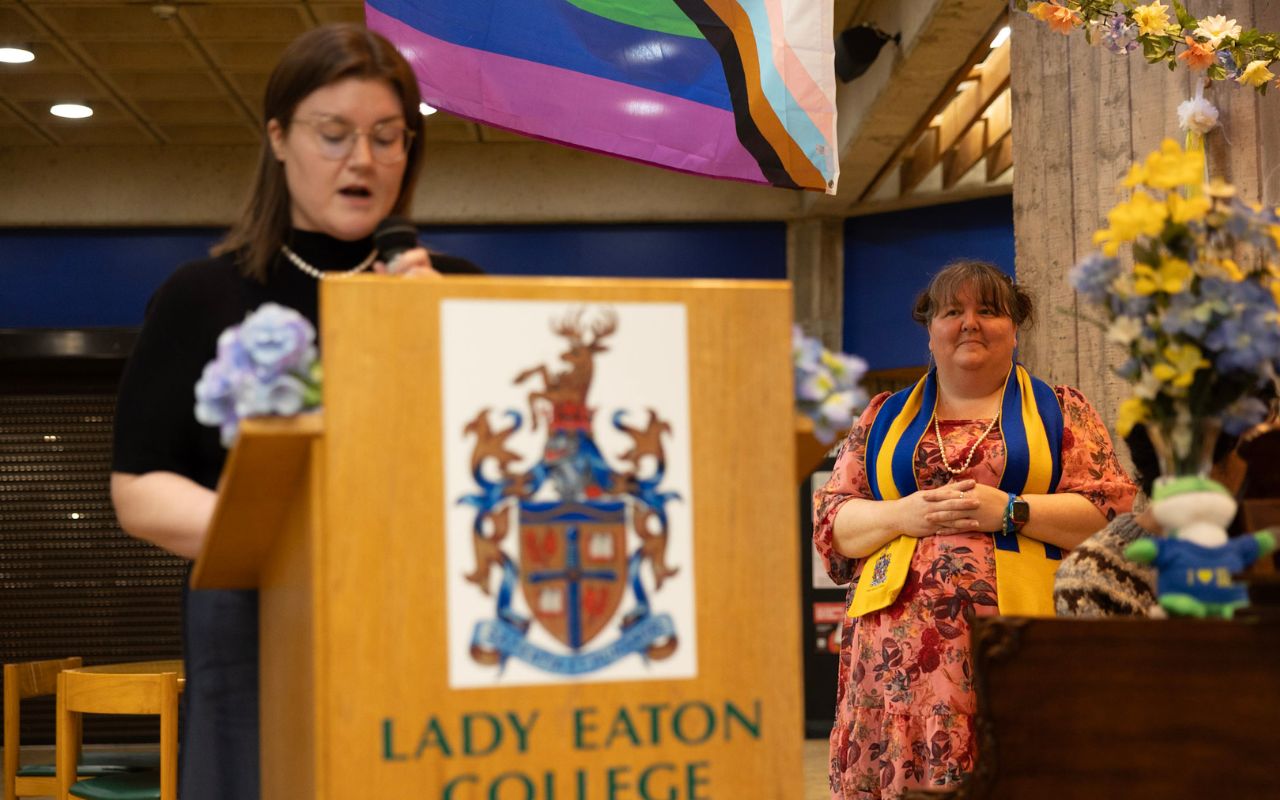 Photo of lady standing behind podium