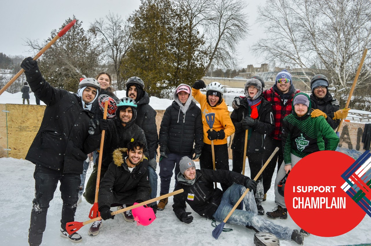 A group photo from Champlain's Broomball Tournament. An overlaid graphic says I Support Champlain.