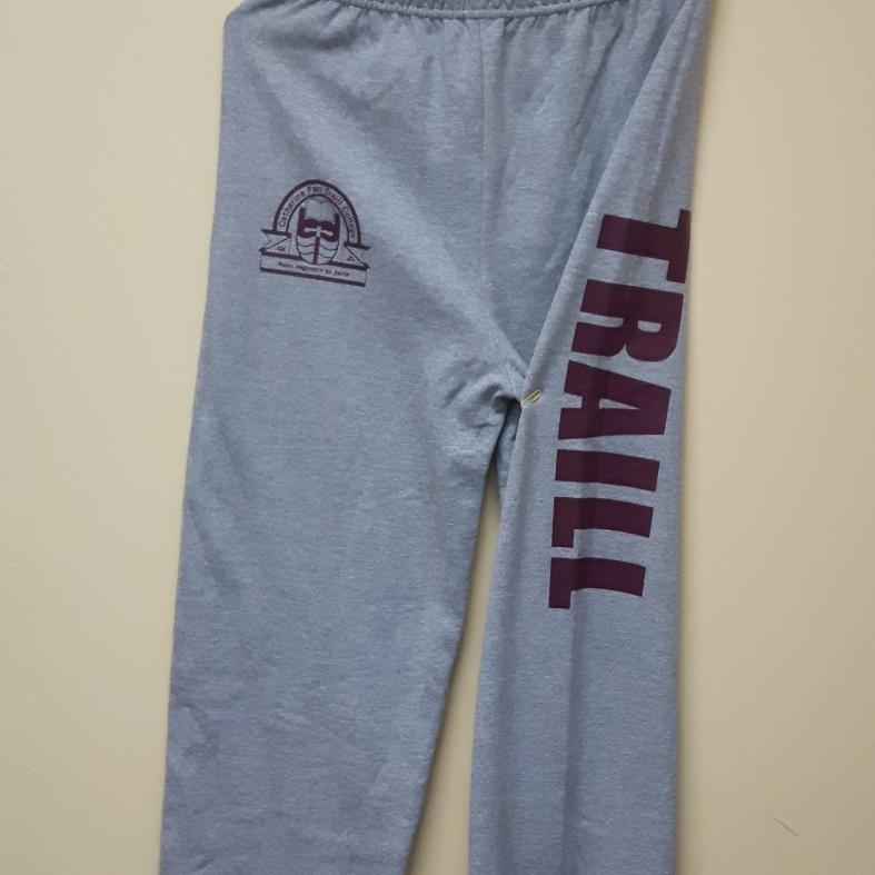 A pair of grey sweatpants with a maroon Traill College logo on the upper right side. Along the left leg is the word TRAILL in maroon.