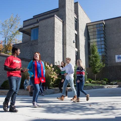 Students walking in the Champlain College courtyard