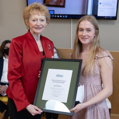 A nursing student receiving an award