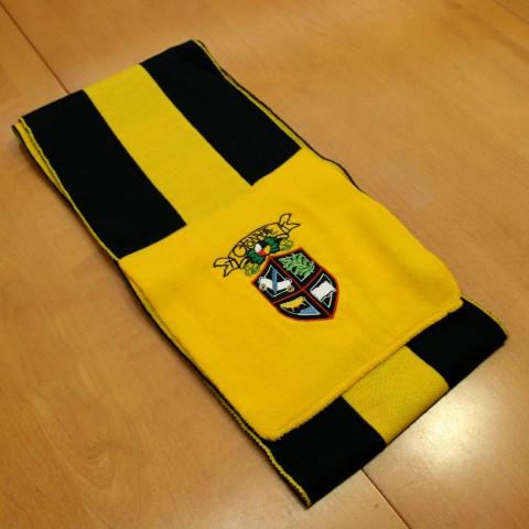 An Otonabee College scarf laying on a table.